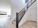 Bright entryway with wood-look floors, black metal staircase, and high ceilings at 1321 Crimson Sunbird Ave, North Las Vegas, NV 89084