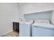 Functional laundry room with a modern washer and dryer, sink, and storage space at 1321 Crimson Sunbird Ave, North Las Vegas, NV 89084