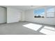 Spacious living room with a large window providing plenty of natural light, enhancing the inviting atmosphere at 1321 Crimson Sunbird Ave, North Las Vegas, NV 89084
