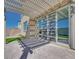 Relaxing patio with stylish pergola and seamless indoor-outdoor living through sliding glass doors at 1321 Crimson Sunbird Ave, North Las Vegas, NV 89084
