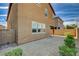 Rock landscaped backyard with partial fencing and a covered patio area at 139 Fulgora St, Henderson, NV 89074