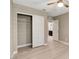 Bright bedroom features a closet, ceiling fan and light wood-look flooring throughout at 139 Fulgora St, Henderson, NV 89074