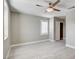 Bright bedroom features a window, ceiling fan, walk-in closet, and light wood-look flooring at 139 Fulgora St, Henderson, NV 89074