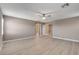 Large bedroom showcasing light wood flooring, ceiling fan, and ample natural light at 139 Fulgora St, Henderson, NV 89074