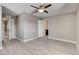 Spacious bedroom features two doors, a ceiling fan, and light wood-look flooring at 139 Fulgora St, Henderson, NV 89074