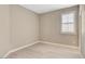A bright bedroom with light hardwood floors and plantation shutters on a window at 139 Fulgora St, Henderson, NV 89074