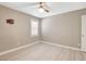 This neutral bedroom features a ceiling fan, plantation shutters, and light wood-look flooring at 139 Fulgora St, Henderson, NV 89074