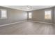 Bright bedroom with modern flooring, three windows, and neutral walls at 139 Fulgora St, Henderson, NV 89074