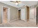 Bright bedroom features a closet, ceiling fan, ensuite bathroom and light wood-look flooring at 139 Fulgora St, Henderson, NV 89074