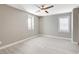 This bedroom features a ceiling fan, window with blinds, and light wood-look flooring at 139 Fulgora St, Henderson, NV 89074