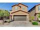Inviting two-story home featuring a brick driveway, two-car garage and well-maintained landscaping at 139 Fulgora St, Henderson, NV 89074