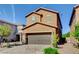 Charming two-story home boasts a brick driveway, two-car garage and well-manicured landscaping at 139 Fulgora St, Henderson, NV 89074