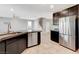 Spacious kitchen area with stainless steel appliances and tile flooring at 139 Fulgora St, Henderson, NV 89074