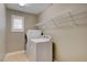 Functional laundry room equipped with modern appliances and ample shelving at 139 Fulgora St, Henderson, NV 89074