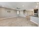 Open-concept living space with neutral paint and tiled floors at 139 Fulgora St, Henderson, NV 89074