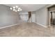 Open-concept living area featuring tile floors, recessed lighting, a staircase, and a modern light fixture at 139 Fulgora St, Henderson, NV 89074
