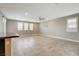 Bright living room featuring neutral paint and large windows with white shutters at 139 Fulgora St, Henderson, NV 89074