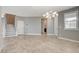 Open living area featuring tile flooring, recessed lights, staircase and contemporary light fixture at 139 Fulgora St, Henderson, NV 89074