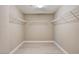 Bright walk-in closet offers ample storage with white wire shelving and light wood grain floors at 139 Fulgora St, Henderson, NV 89074