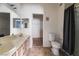 Bright bathroom features double sinks, a toilet, and a shower with a curtain at 1838 N Jones Blvd, Las Vegas, NV 89108
