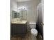 Bathroom featuring a vanity, toilet, and shower with a curtain at 1838 N Jones Blvd, Las Vegas, NV 89108