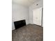 Spare bedroom featuring modern floors, window and closet with sliding panel doors at 1838 N Jones Blvd, Las Vegas, NV 89108