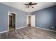 Spacious bedroom featuring wood-look floors, a ceiling fan, and neutral wall color at 1838 N Jones Blvd, Las Vegas, NV 89108