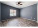Spacious bedroom featuring wood-look flooring and a ceiling fan at 1838 N Jones Blvd, Las Vegas, NV 89108
