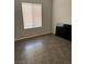Cozy bedroom features modern floors, window for natural light and neutral paint at 1838 N Jones Blvd, Las Vegas, NV 89108