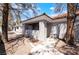 Charming home featuring a covered porch, beautiful landscaping, and a tile roof at 1838 N Jones Blvd, Las Vegas, NV 89108