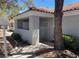 Charming condo with tile roof, covered entry, and walkway through landscaped front yard at 1838 N Jones Blvd, Las Vegas, NV 89108