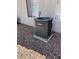 Goodman HVAC unit sits beside the home with beige exterior and gravel ground cover at 1838 N Jones Blvd, Las Vegas, NV 89108