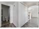 Hallway with access to a bathroom and closet with wood-look flooring at 1838 N Jones Blvd, Las Vegas, NV 89108