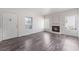 Well-lit living space with a decorative fireplace and stylish laminate floors at 1838 N Jones Blvd, Las Vegas, NV 89108