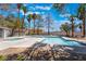 Community pool with palm trees and lounge area at 1838 N Jones Blvd, Las Vegas, NV 89108