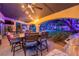 Covered patio with an outdoor table, seating, ceiling fans, and backyard views at 1925 Grey Eagle St, Henderson, NV 89074