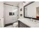 Modern bathroom features a sleek glass-enclosed shower, stylish vanity, and contemporary finishes at 1925 Grey Eagle St, Henderson, NV 89074