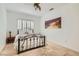 Comfortable bedroom features natural light, neutral walls and a plush bed, creating a serene retreat at 1925 Grey Eagle St, Henderson, NV 89074