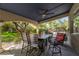 Relaxing covered patio includes an outdoor dining space, grill and green backyard at 1925 Grey Eagle St, Henderson, NV 89074