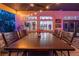 An outdoor dining space on a covered patio with lighting, ceiling fan and views of the yard at 1925 Grey Eagle St, Henderson, NV 89074
