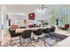Spacious dining room with a large live edge table, modern decor, and ample natural light at 1925 Grey Eagle St, Henderson, NV 89074