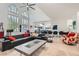 Spacious living room with high ceilings, large windows, and modern furnishings, creating an open and airy ambiance at 1925 Grey Eagle St, Henderson, NV 89074