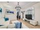 Bright and airy living room with a comfortable white sofa, stylish decor, and modern lighting fixtures at 1925 Grey Eagle St, Henderson, NV 89074