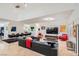 Bright living room with a mix of comfortable seating, a large TV, and stylish decor in an open layout at 1925 Grey Eagle St, Henderson, NV 89074