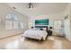 Spacious main bedroom features travertine floors, plantation shutters, and a modern ceiling fan at 1925 Grey Eagle St, Henderson, NV 89074