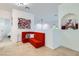 Cozy sitting area with a red built-in sofa and stylish pillows, creating a warm and inviting space at 1925 Grey Eagle St, Henderson, NV 89074