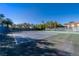 Community tennis court featuring well-maintained playing surfaces, fencing, and lush landscaping at 1925 Grey Eagle St, Henderson, NV 89074