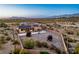 Aerial view of property in desert setting showcasing landscaped yard and mountain views at 2051 Saginaw Ave, Pahrump, NV 89048