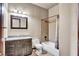 This bathroom has a granite vanity and a shower and tub with tiled walls at 2051 Saginaw Ave, Pahrump, NV 89048