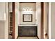 Bathroom features a dark vanity with granite countertop, a well-lit mirror, and ample storage at 2051 Saginaw Ave, Pahrump, NV 89048